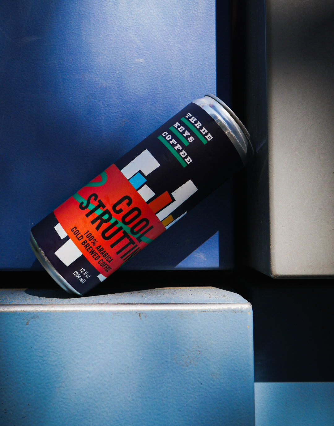Original photograph of the Three Keys Coffee “Cool Struttin’” can on blue steel